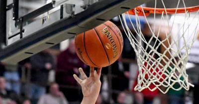 Basketball at hoop boys Stock