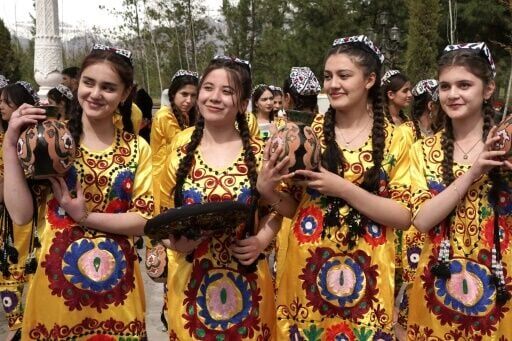 Tajik women in traditional attire celebrate the first day of spring in Dushanbe in March 2024. Authorities in the secular Muslim country are advising women to shun skimpy Western clothes as well as Islamic full-body coverings for national dress